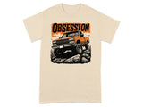 Cream t-shirt with an orange truck graphic and the word OBSESSION.