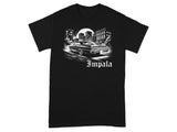 Black t-shirt with a black and white graphic of a classic car and city skyline, with the word "Impala".