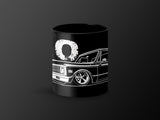 Black mug with white outline of a classic pickup truck and the number 90.