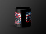 Black mug with red trucks and American flag graphic.