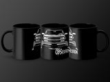 Three black mugs with white lifted truck and "Obsession" graphics on a dark background.