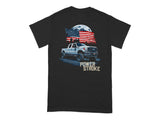Black t-shirt with a graphic of a white pickup truck, American flag, and city skyline.