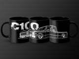 Three black mugs featuring white C10 truck outlines and distressed text.