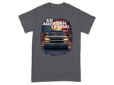 Front view of a dark blue pickup truck with "AN AMERICAN LEGEND" text and American flag.