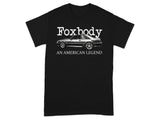 Black t-shirt with a silver Ford Mustang Foxbody graphic and text "Foxbody AN AMERICAN LEGEND".