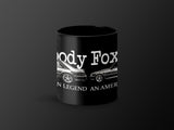 Black mug with white text reading "ody Fox" and images of two cars.